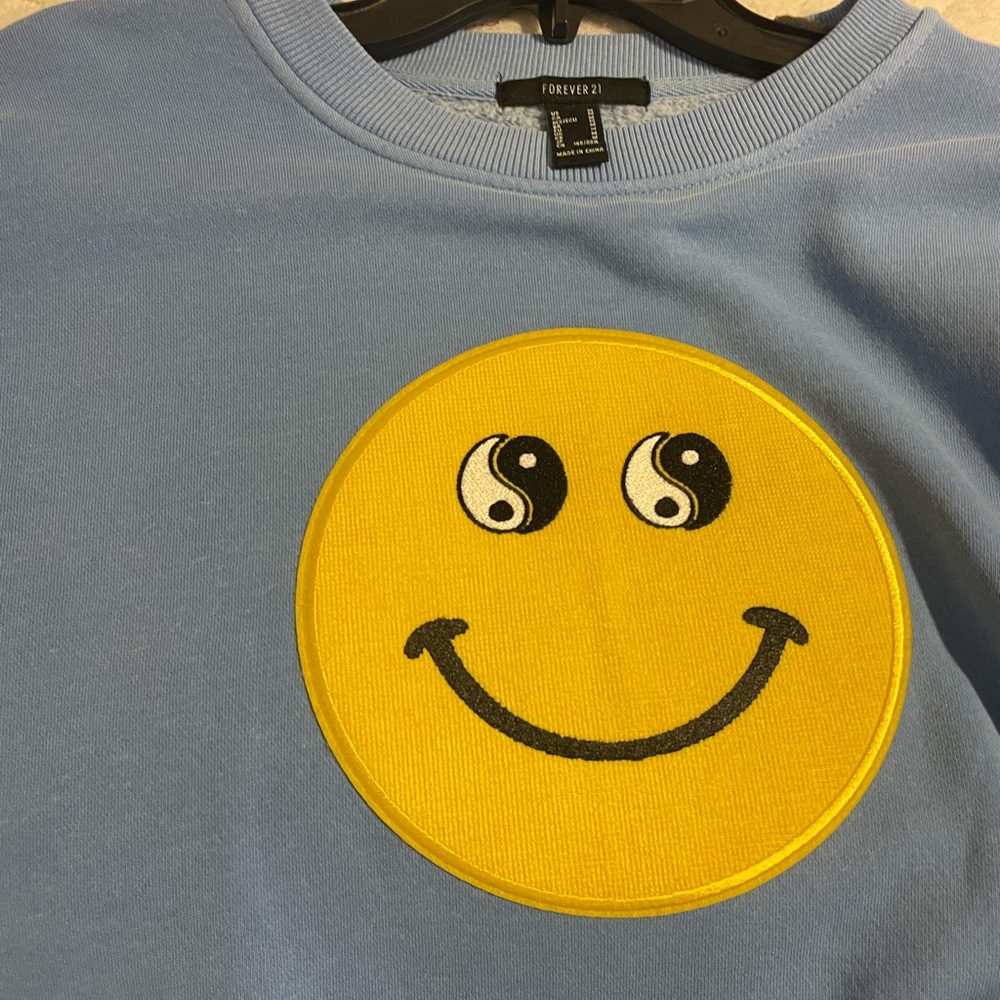 Light blue smiley sweatshirt
